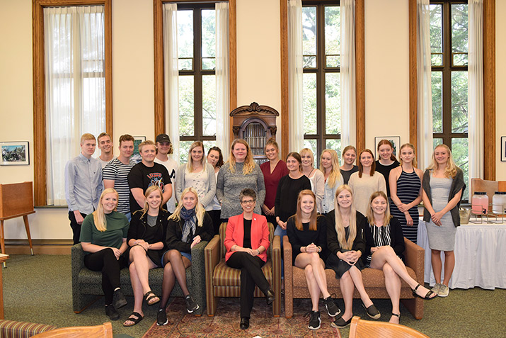 A group of students from Tradium College with DelVal President Dr. Maria Gallo. 