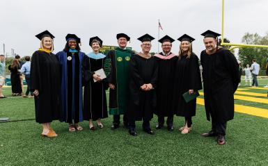 A photo of most of the university cabinet together at graduation. 