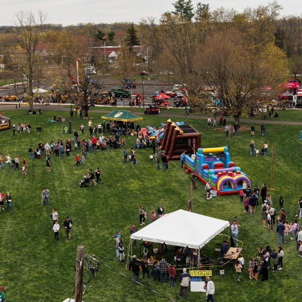 An aerial view of the tents and games on the field at aday.