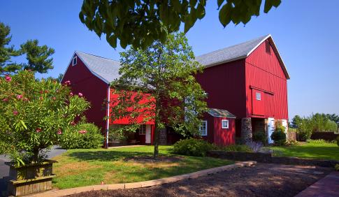 A large red barn on the DelVal campus.