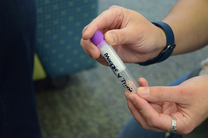 A tube containing a sample of saliva from a therapy dog named Trixie.