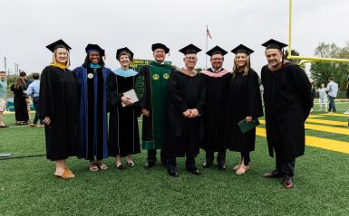A photo of most of the university cabinet together at graduation.