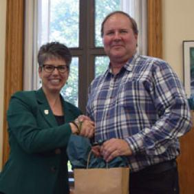 DelVal President Dr. Maria Gallo shakes hands with Robert Brown, a faculty member and alumnus of the University. 