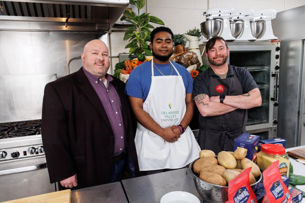 Broc Sandelin, Dean of Agriculture and Environmental Sciences, Alan Volant ’24, and Chef Lee Chizmar, owner of Bolete and Mister Lee’s Noodles