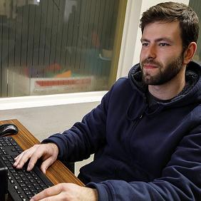 A student looking at a computer