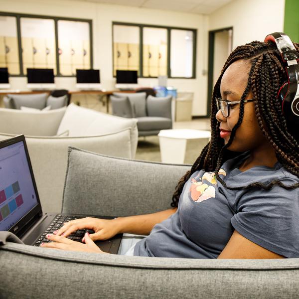 A student works on a laptop