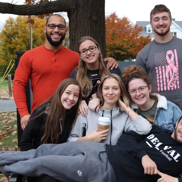 A group of six students smiling.