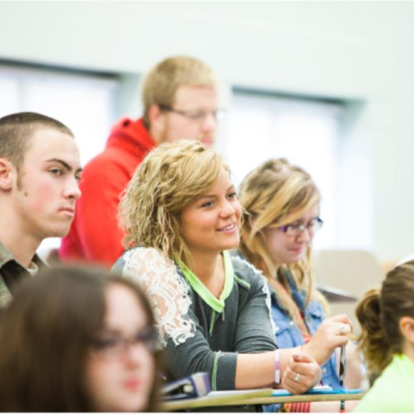 College-aged students in a classroom.