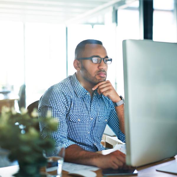 a man sitting at his computer